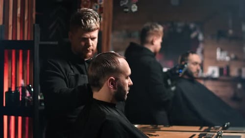 Barber Giving Haircut to Client in Stylish Shop