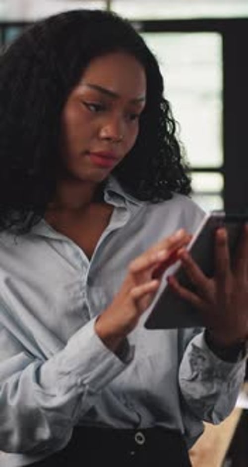 Woman Using Tablet Device in Office Setting