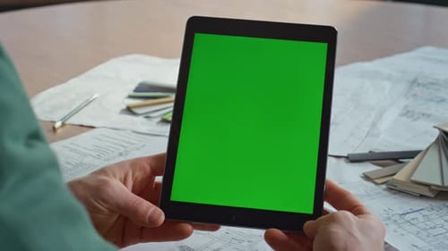 Creator Watching Mockup Tablet at Workplace Architectural Company Closeup