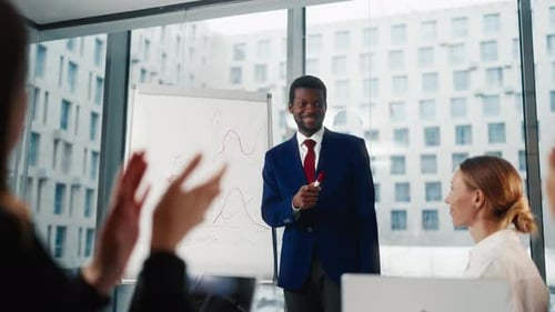 Startup Presentation for Investors Black Man Drawing Sales Diagram in Office Diverse People Working