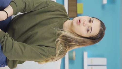 Young Woman Massages Her Aching Neck At Home