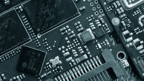 Chips and microcircuits background, different types circuits in black and white colors lie on table