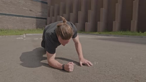 Young Adult Man Doing Plank Exercise Outdoor