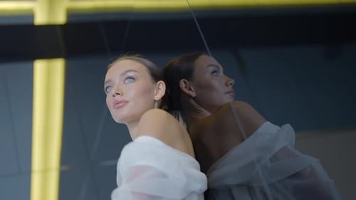 Elegant Woman Posing in a Fashionable White Top