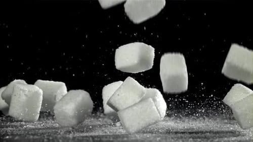 Sugar Cubes Fall on the Table Filmed on a Highspeed Camera at 1000 Fps