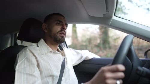 Man driving car. Male driver inside car