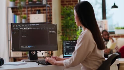 Focused Woman Coding in Modern Home Office