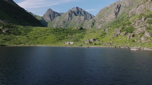 Abandoned House by Lake and Mountains in Lofoten 1