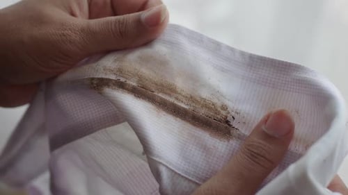 A Closeup View of a Grimy White Shirt with a Soiled Collar Requiring Cleaning