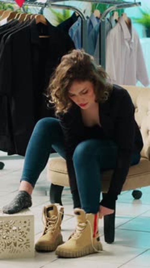 Vertical Video Elegant Woman Trying on a Pair of Shoes in Department Store
