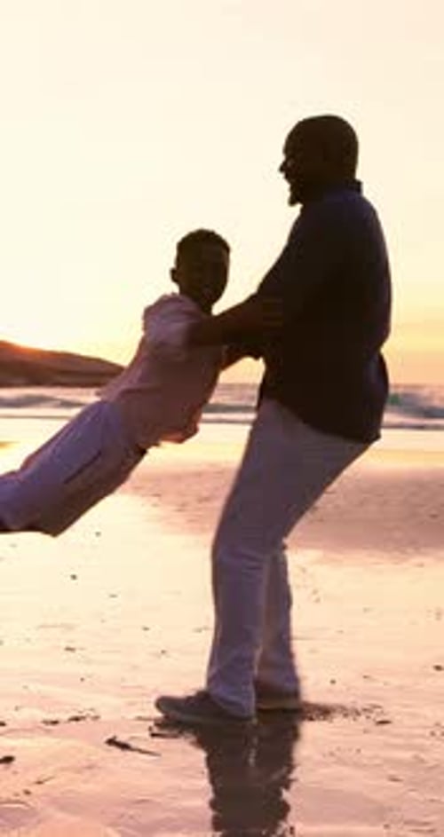 Father, child and spinning at beach in sunset for fun, freedom or support on holiday