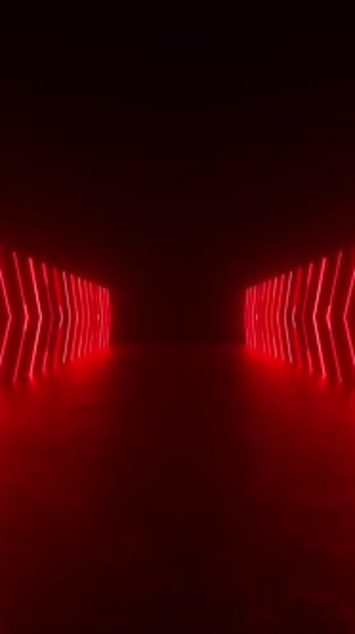 A tunnel of red neon lights glowing in a dark room, creating a mesmerizing visual effect.