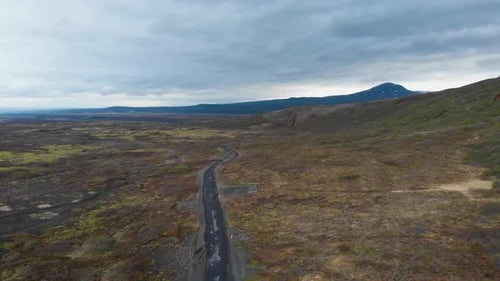 Aerial view over gravel road located in the icelandic highlands showing the epic landscape and some