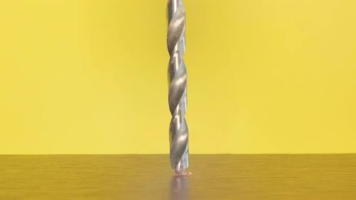 Drill Bit Drilling Into Wood Close Up