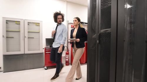 Team of Business People Data Analysts Specialist Coworking in Data Center Monitoring Supercomputer