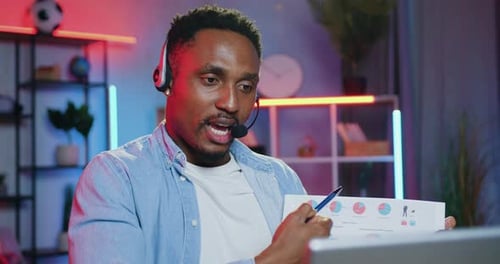 Man Presenting Data During Virtual Meeting