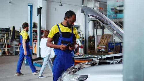 Mechanic Does Maintenance on Client Car
