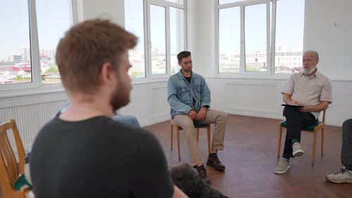 Group of Adults Meeting in a Circle Indoors