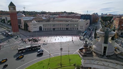Aerial view of busy street traffic and people crossing road at roundabout in city center Plaza