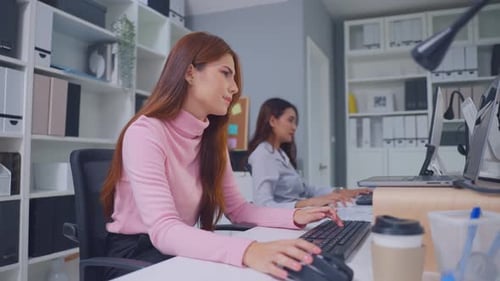 Exhausted Asian young businesswoman overwork late in office workplace.
