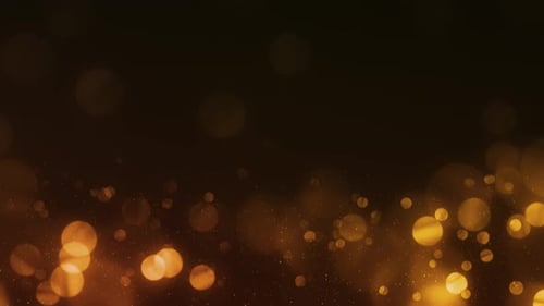 Glamour Collection: Golden bokeh with tiny particles rising from bottom on a dark background
