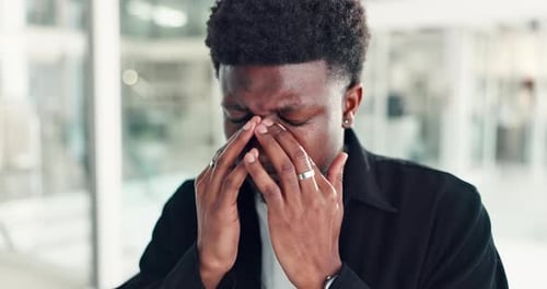 Stress, headache and black man in office with burnout, fatigue or anxiety for creative project