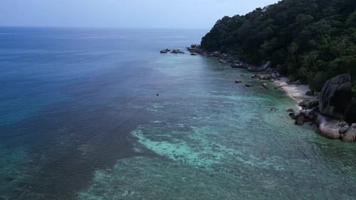 untoucht beach at granite rocks island, turquoise water. Marvelous aerial view flight drone