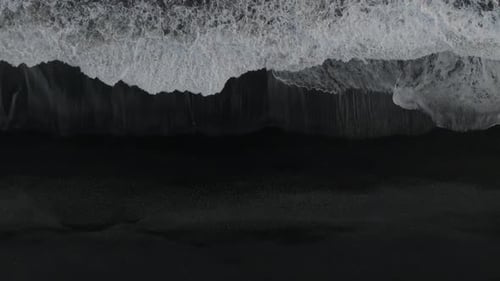 Aerial view of a black sand beach in Iceland.