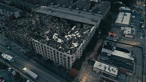 Ash and destroyed houses in American town after fire. Environmental damage. Aerial top down orbit sh