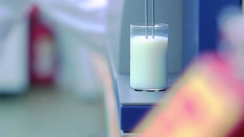 Milk Analysis. Analysis of Milk Sample on Laboratory Equipment. Modern Equipment. Scientist