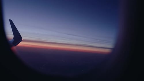 Airplane flying over city