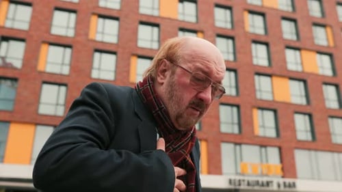 Man Experiences Chest Pain Outdoors in City