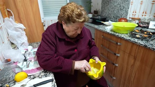 Senior Woman Preparing Food in the Kitchen