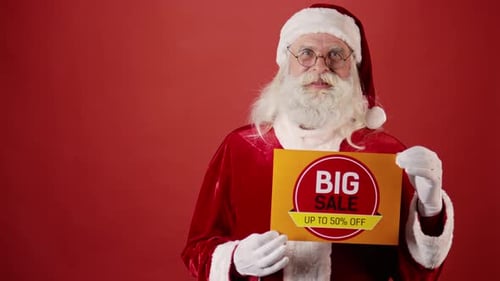 Cheerful Santa Claus Holding Big Sale Sign