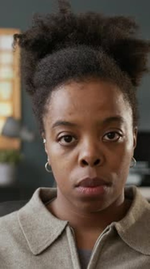 Vertical POV of Focused Black Female Programmer Working on Computer