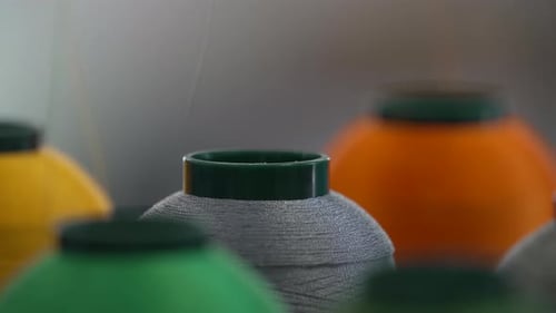 Colorful Threads On Modern Embroidery Machine. Selective Focus Shot