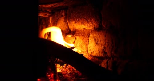 Burning Wood in a Stone Oven in the House Winter Home Heating