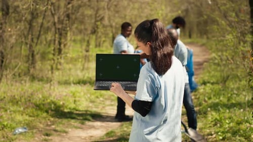 People Cleaning Up Garbage in Urban Green Space