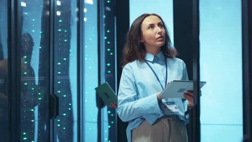 Skilled Professionals Engaged in a Modern Data Center Utilizing Advanced Technology Solutions