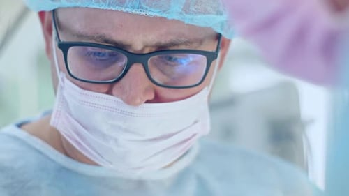 the Surgeon Performs a Surgical Operation