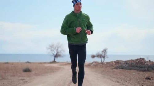 Runner In Motion Closeup Of Running Man On Dirt Trail Focused Male Athlete Jogging Swiftly With