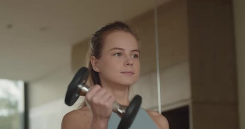 Female Hands Taking Bodybuilding Dumbbells in Gym Club Close Up Woman Hands Taking Weight Lifting in