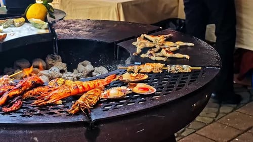 Grilling Seafood at Outdoor Urban Marketplace