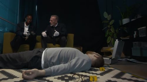 Multiethnic Police Agents Discussing Murder Scene in Office