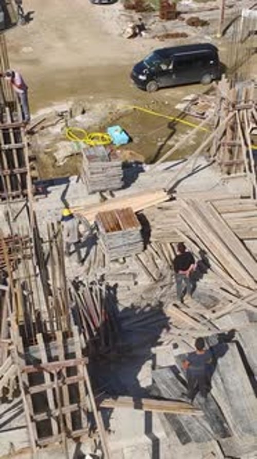 Aerial View of Workers at Construction Site