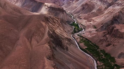 Himalayan Valley with a Curving Road and River Drone View