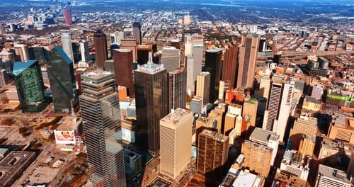 Flying closer to the group of skyscrapers in the city center. Urban panorama of Dallas, Texas, USA