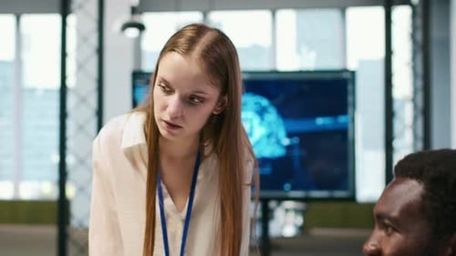 Office Colleagues Talking About Computer Technology