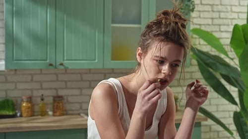 Young Woman at the Table in the Kitchen Preparing Spring Rolls for Healthy Lunch Woman Cutting