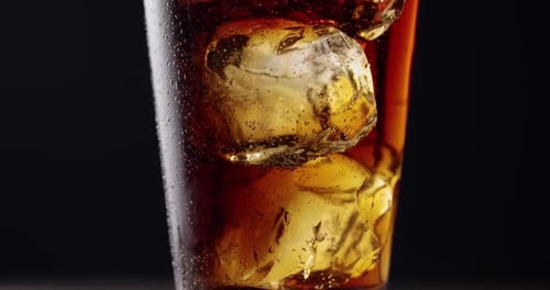 Refreshing Drink with Ice Cubes in Glass